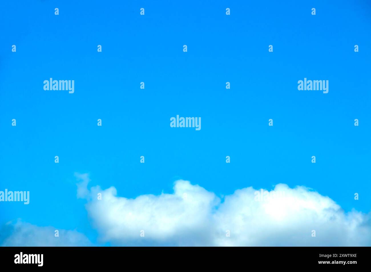 blue sky and white fluffy cumulus clouds Stock Photo