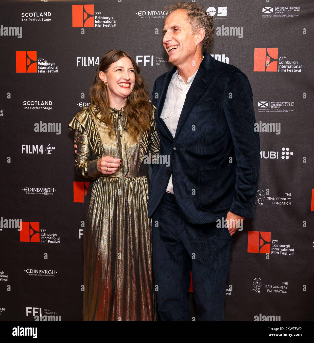 Cameo Cinema, Edinburgh, Scotland, UK, 20 August 2024.  Edinburgh International Film Festival:  red carpet photocall for the film The Radleys at the Cameo Cinema. Pictured: Kelly Mcdonald (actor), Euros Lyn (Director/Filmmaker). Credit: Sally Anderson/Alamy Live News Stock Photo