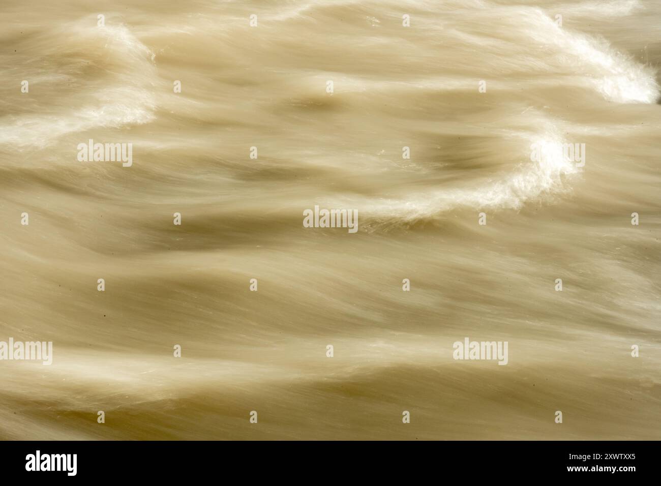 Muddy Water Of Carbon River Rushes Past with blurry finish Stock Photo