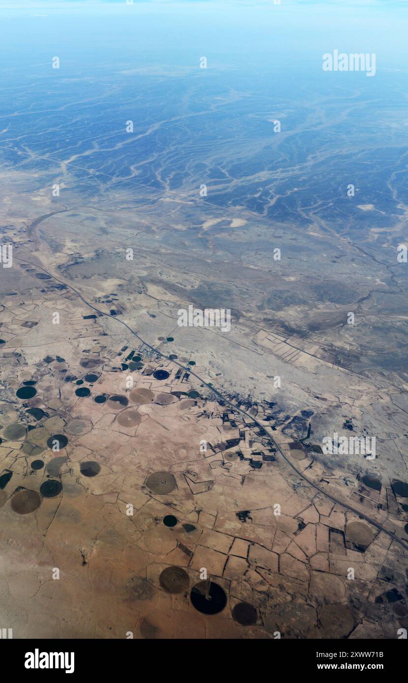 Aerial view of circular agriculture fields in the Arabian desert in ...