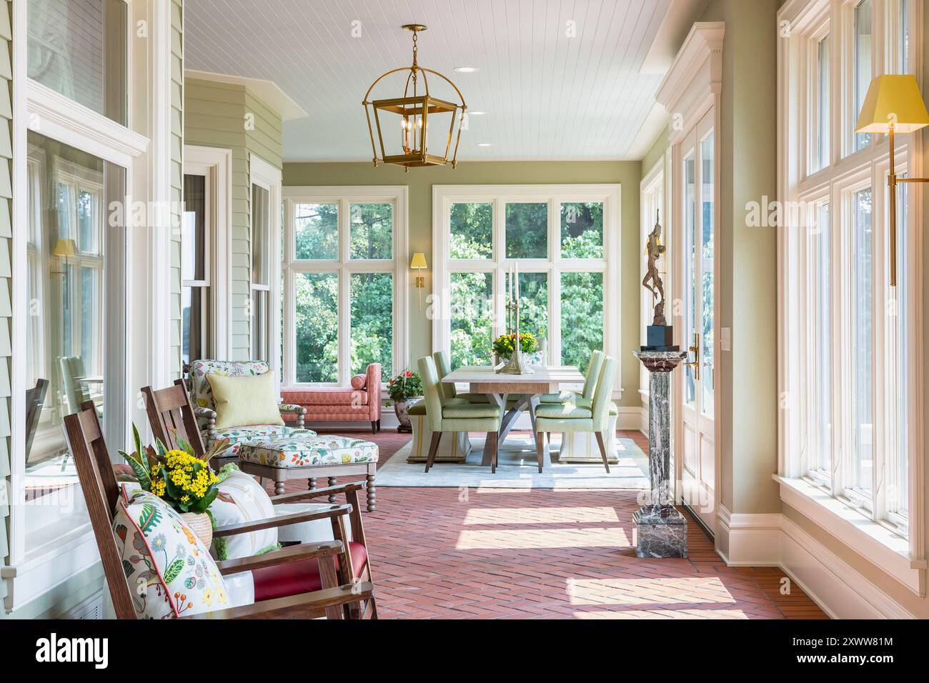 High end four season porch with rocking chairs and dining table and ...