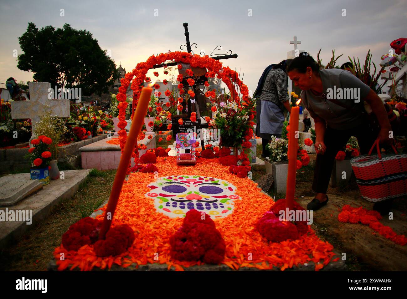Ciudad de Mexico, Mexico - November 2. 2023: Colorful tomb decoration in the Mixquic Cemetery Stock Photo