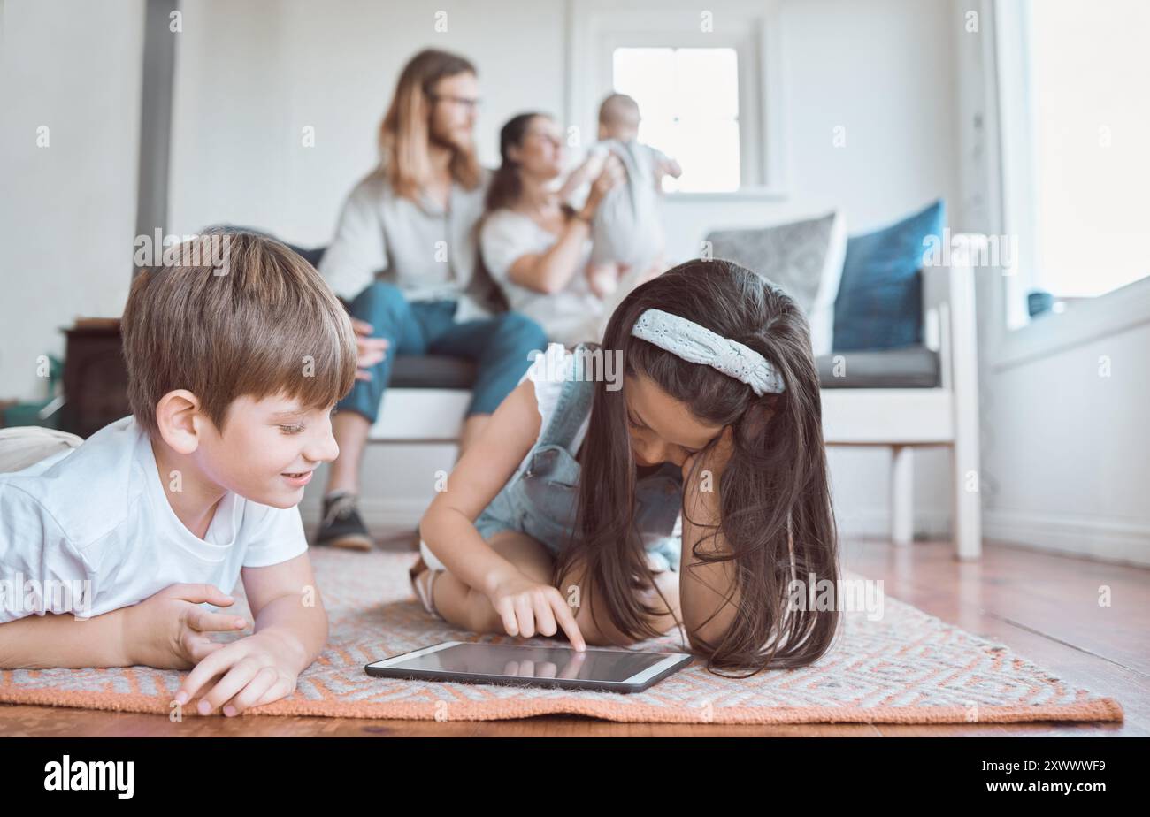 Happy children playing tablet together hi-res stock photography and ...