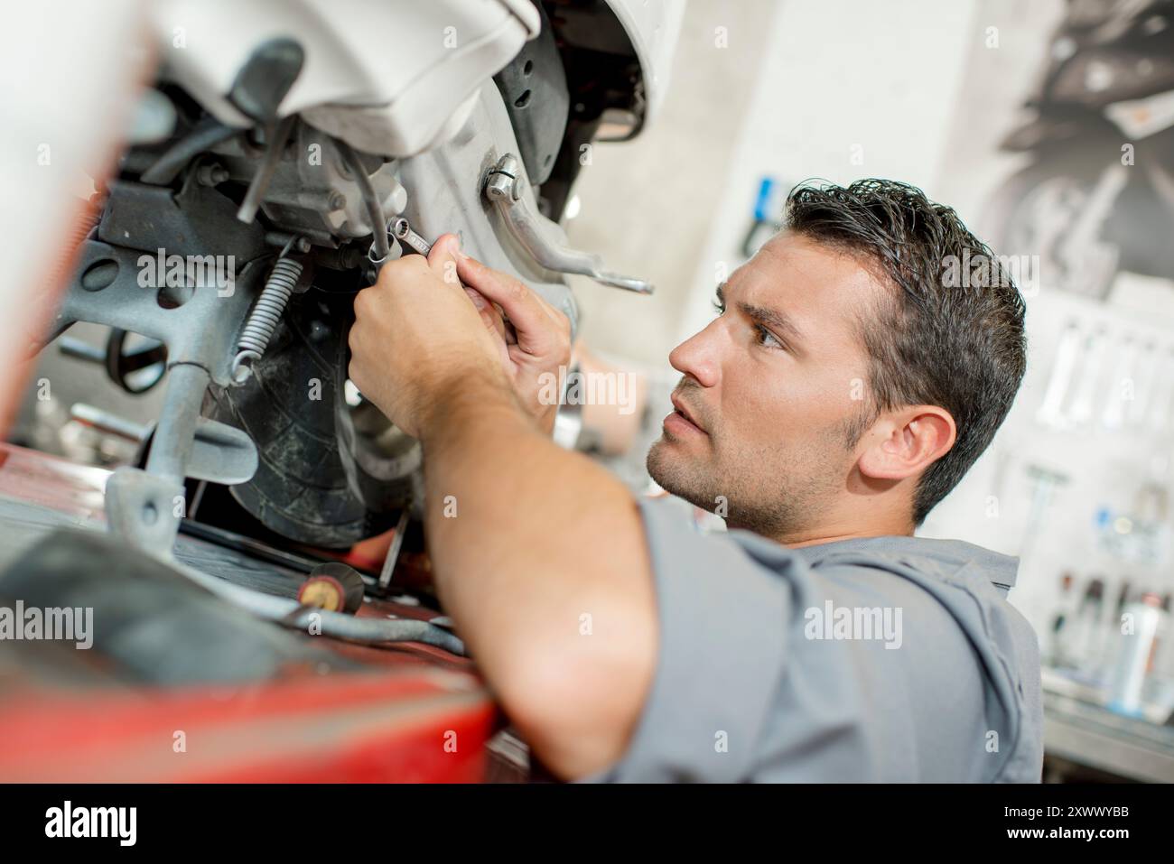 Workcomp Mechanic a mechanic doing some work Stock Photo - Alamy