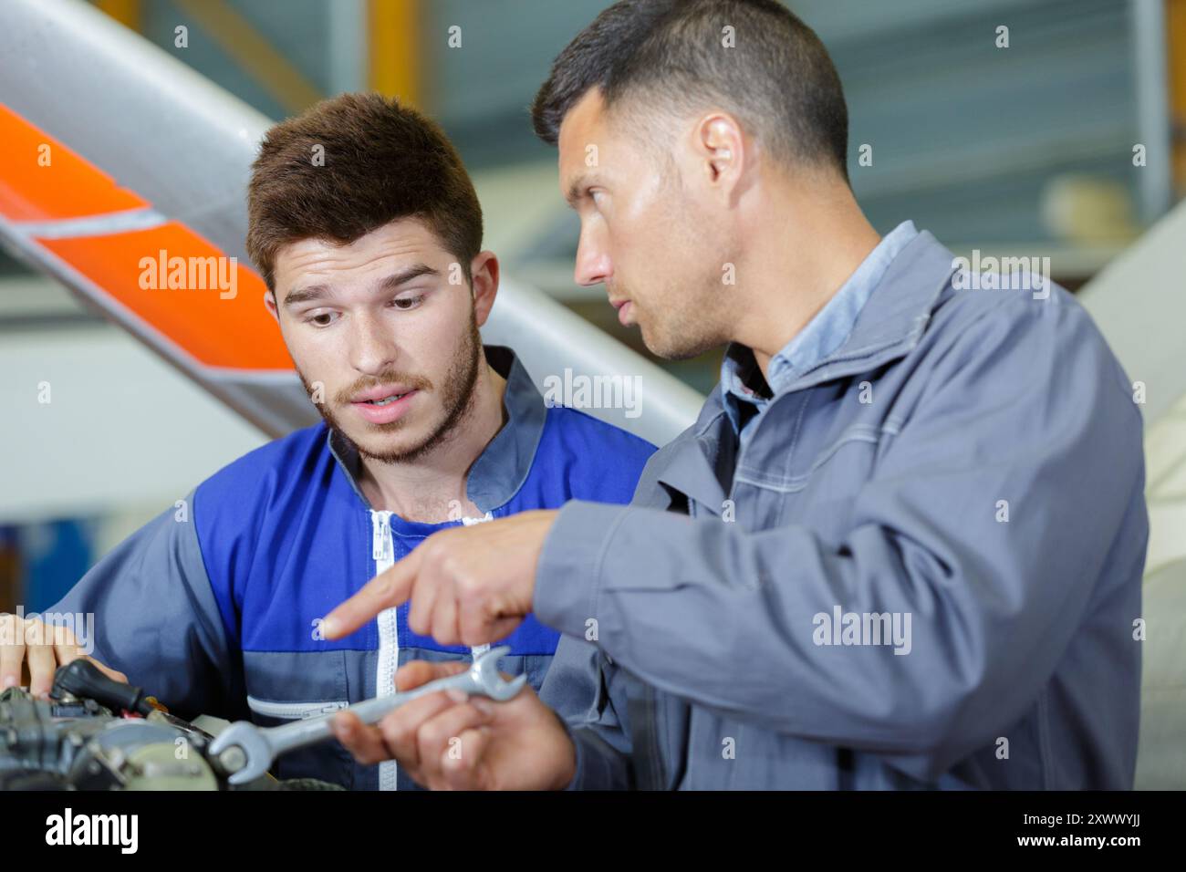 aircraft assemblers at work talking Stock Photo - Alamy