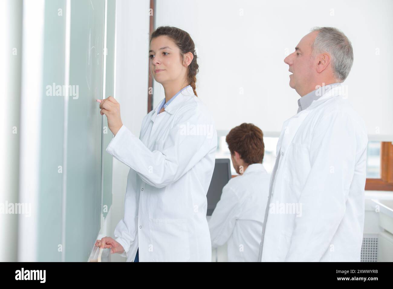 Chemistry class student doing experiment hi-res stock photography and ...