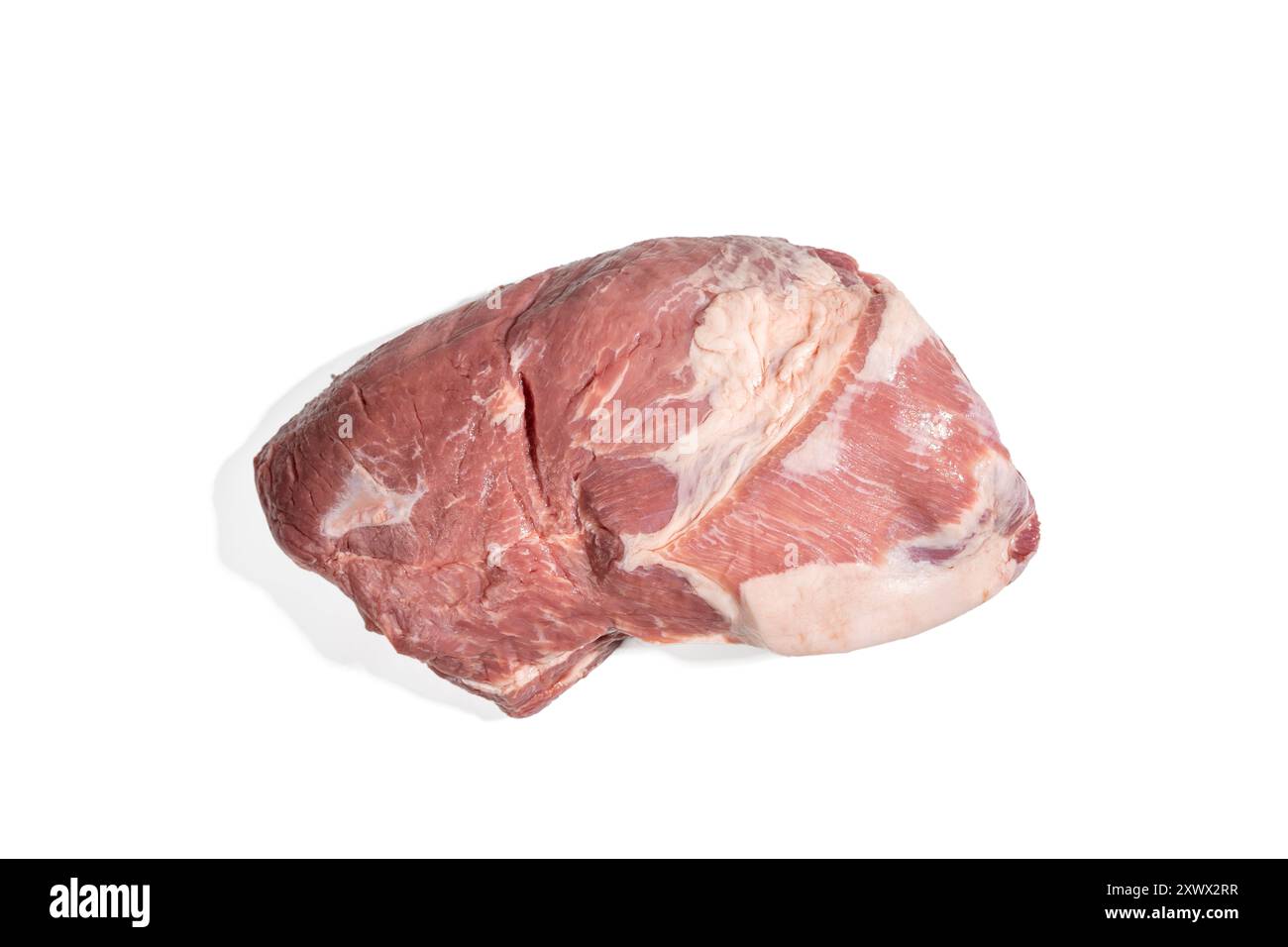 A piece of meat is displayed on a white background. The meat is raw and ...