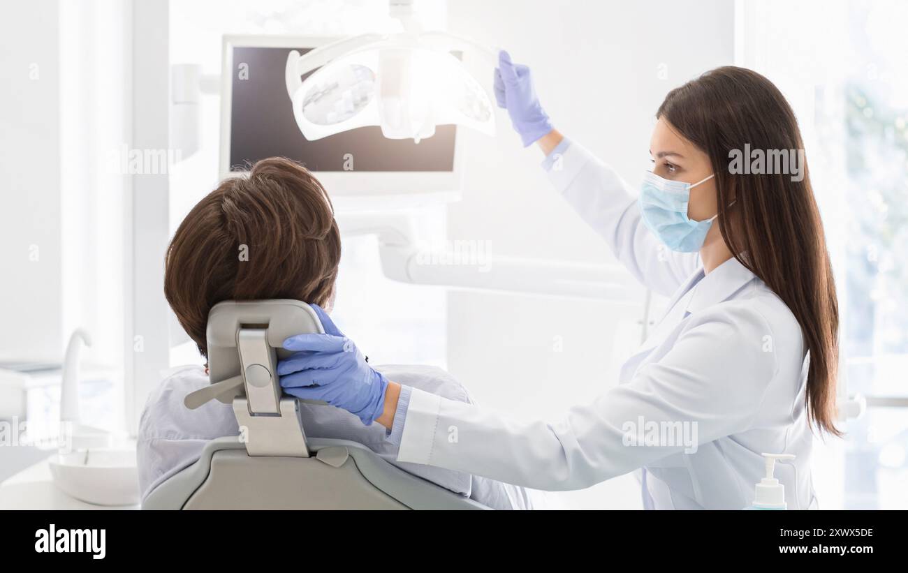 Dentist Doctor Turning On Lamp Before Treating Patient Stock Photo Alamy Dentist Doctor Turning On Lamp Before Treating Patient Stock Photo Alamy