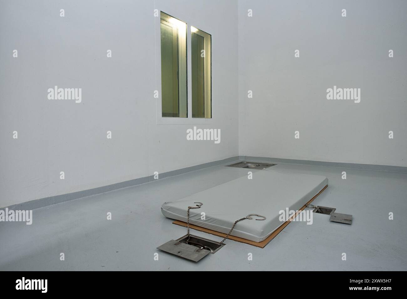 Interior view of a high security prison cell at Waldeck Prison, located in Mecklenburg-Western Pomerania, Germany. Designed for male offenders serving long sentences, the cell features minimal furnishings, ensuring secure confinement. Stock Photo