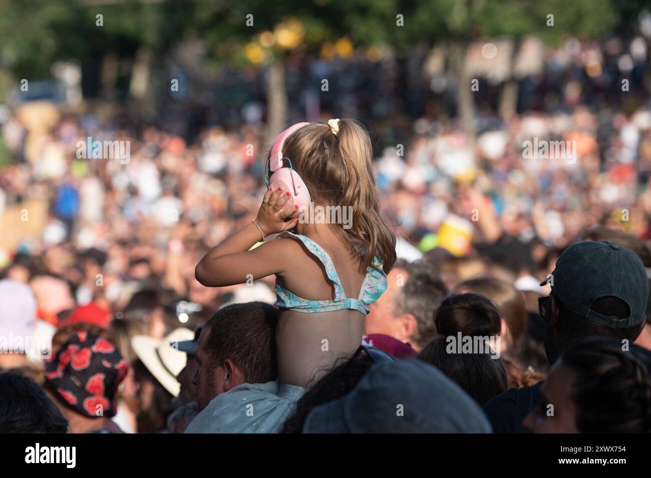 Aluna Festival in the Ardeche department (south-eastern France): young child wearing earmuffs at a festival Stock Photo