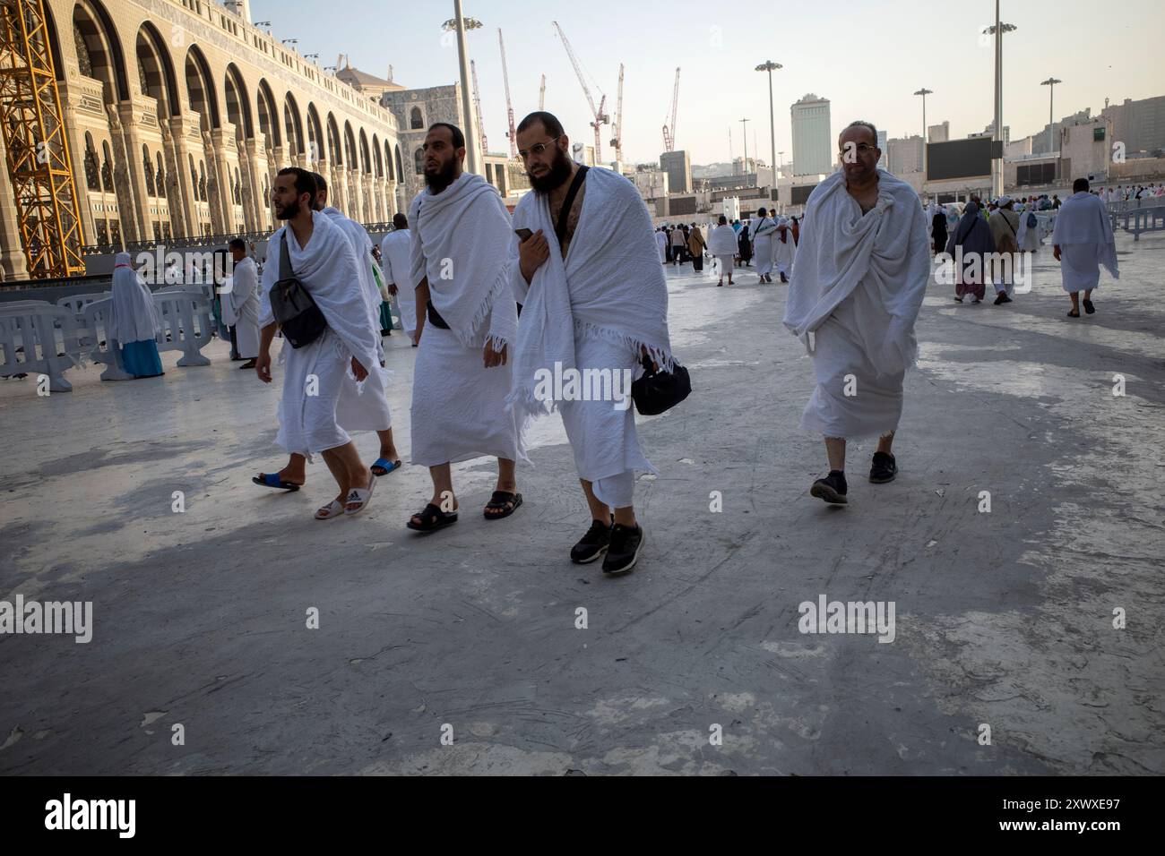 Mecca, Saudi Arabia - June 5, 2024: Hajj and Umrah pilgrim from Europe countries, walking near Masjidil Haram, Great Mosque in Makkah, Saudi Arabia. H Stock Photo