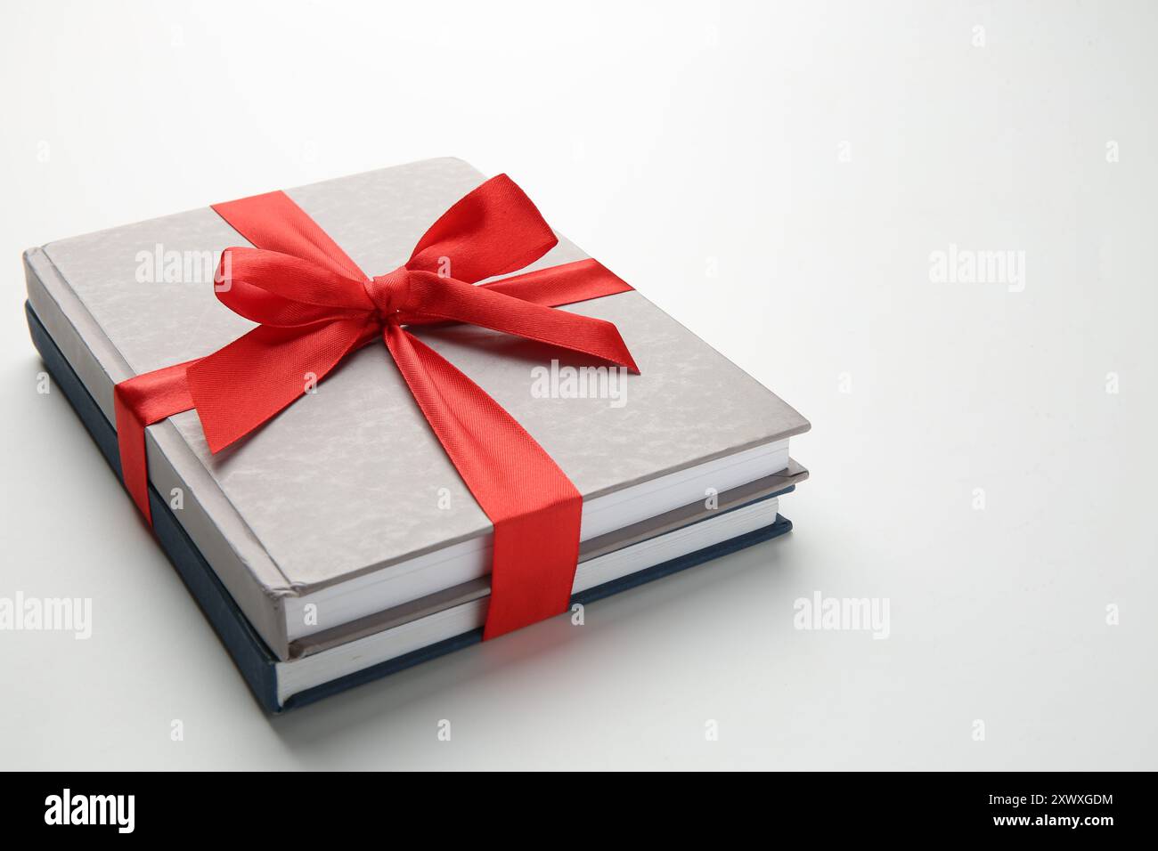 Books tied with red ribbon on white background. Space for text Stock ...