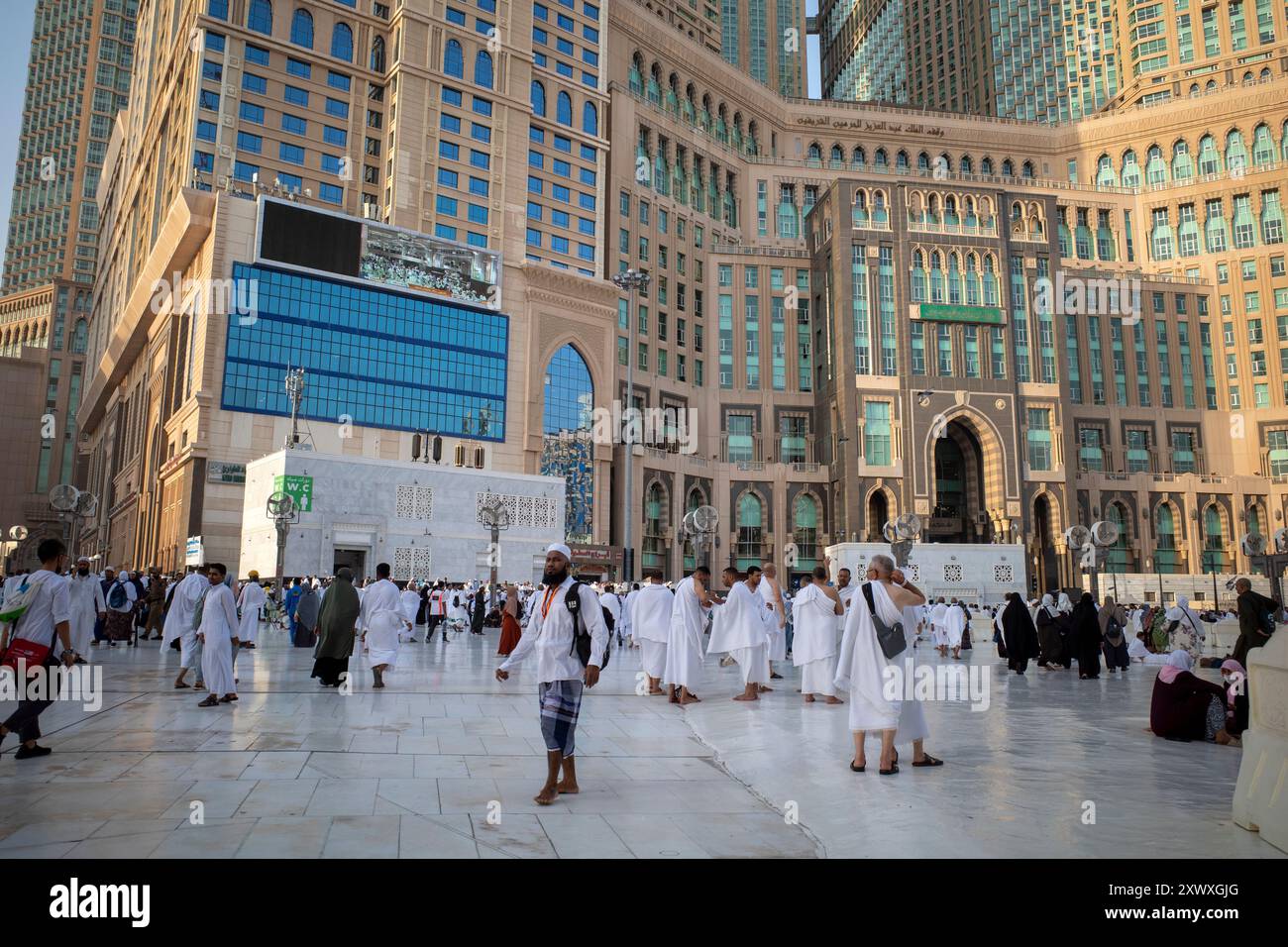 Mecca, Saudi Arabia - June 5, 2024: Hajj and Umrah pilgrims from around the world walking near Masjidil Haram, Great Mosque in Makkah. Hajj 2024. Stock Photo