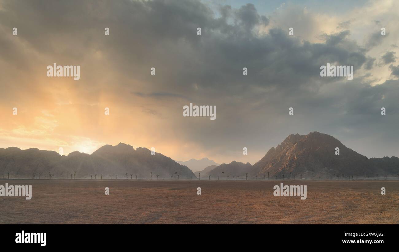 Dramatic sunset over desert landscape with mountain silhouette and ...