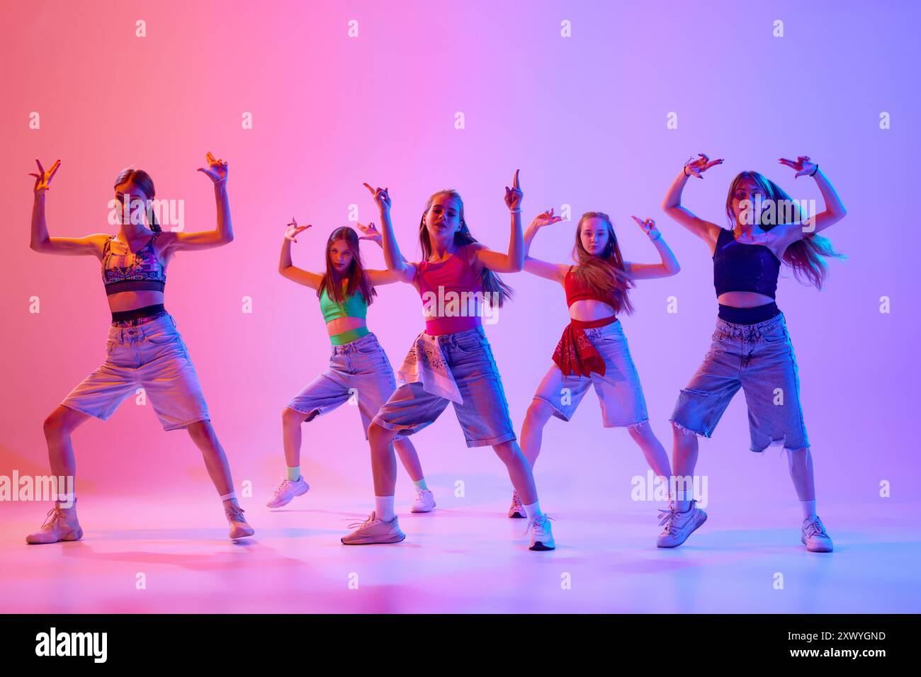 Group pf girls, dancers dancing dressed stylish sport, casual outfits ...