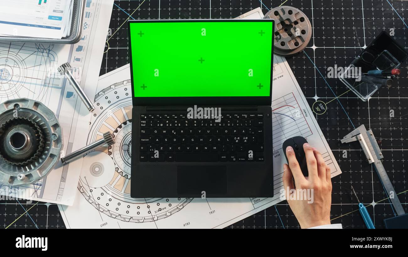 Anonymous Industrial Specialist Using Laptop Computer with Mock Up ...