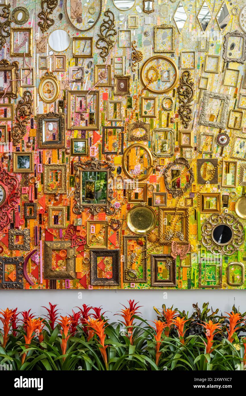 Colorful plants and mixed-media art display by Atlanta artist Lillian Blades for Orchid Daze at the Atlanta Botanical Garden in Atlanta, GA. (USA) Stock Photo