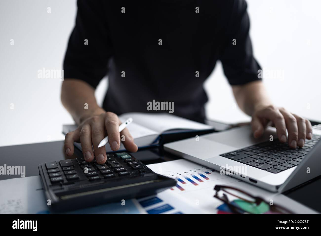 Businessman Analyzing Financial Data and Reports Stock Photo