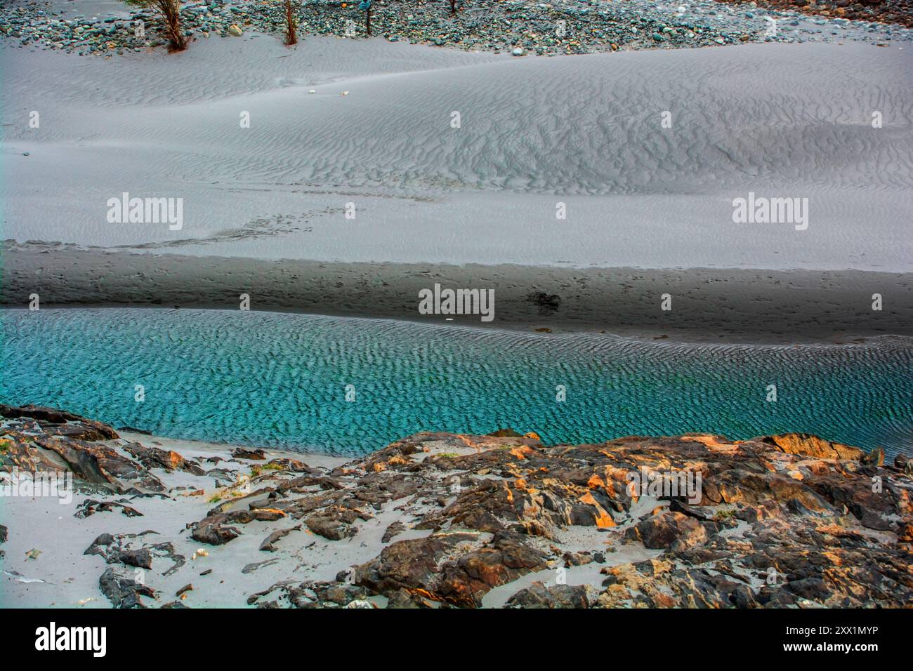 Beautiful contrast of the Himalayan mountains and sand along river in the Kargil region Stock Photo
