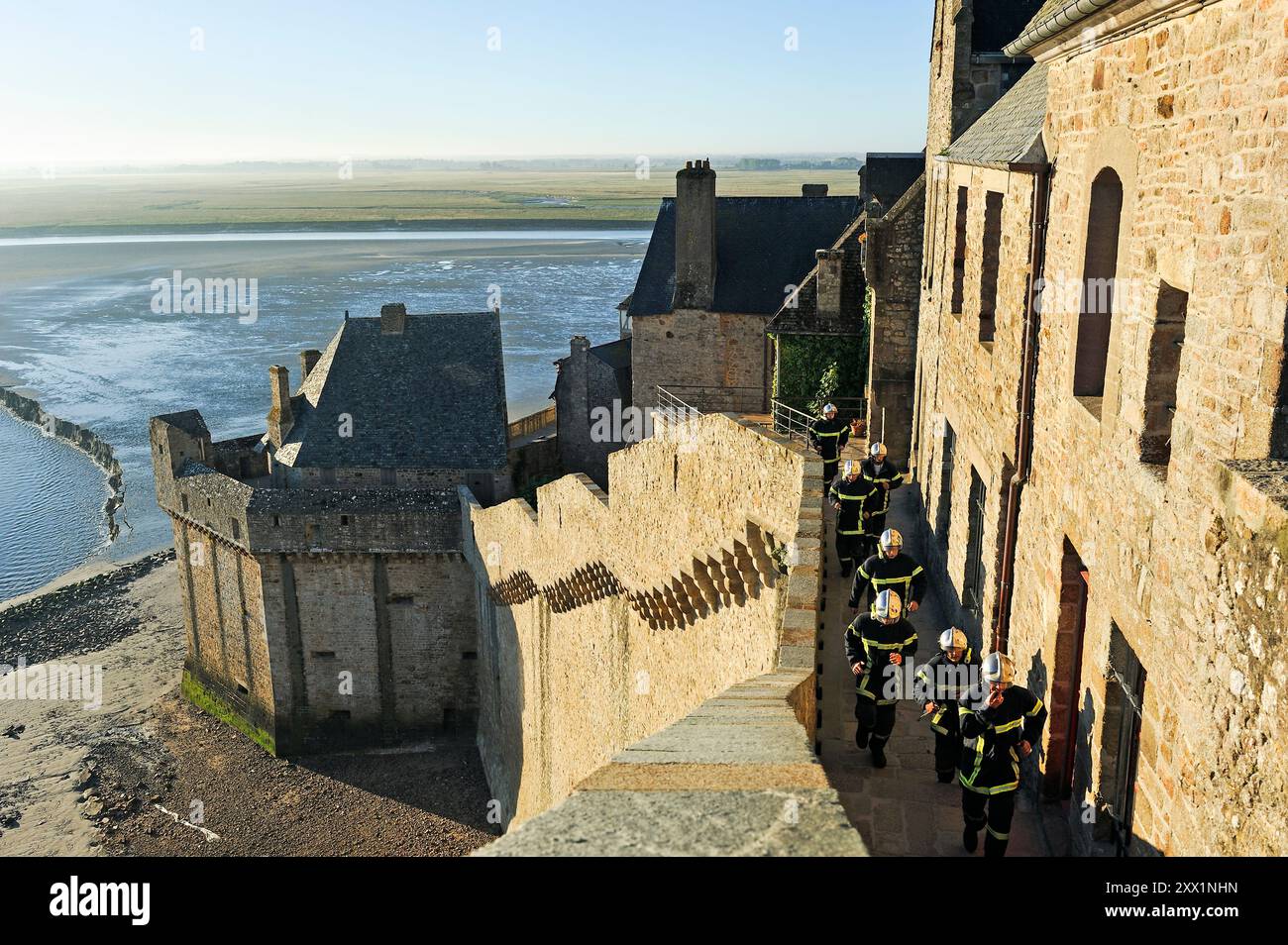 Firemen in training on the ramparts of Mont-Saint-Michel, Manche ...