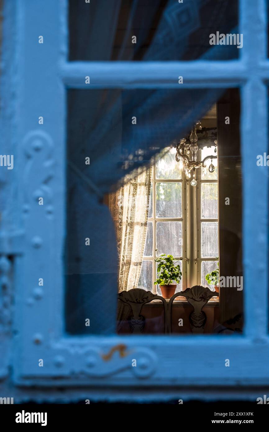 Evening light through a window at the Mariager Museum, a historical museum in Mariager, Denmark Stock Photo