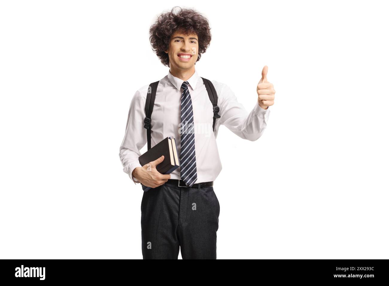 College student holding books and showing thumbs up isolated on white ...