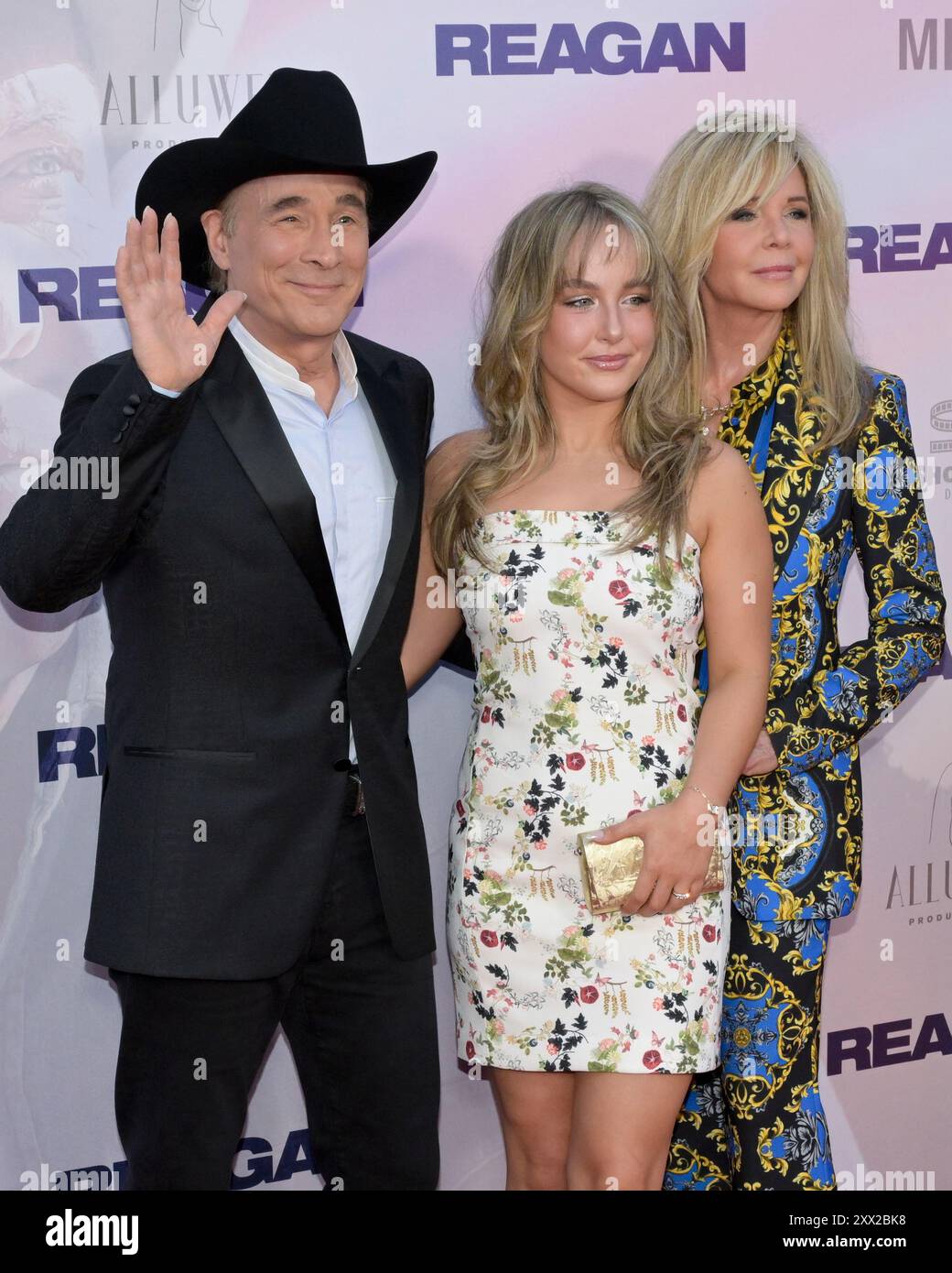 August 20, 2024, Hollywood, California, USA: (L-R) Clint Black, Lily Pearl Black and Lisa Hartman Black attend the Los Angeles Premiere of ''REAGAN' (Credit Image: © Billy Bennight/ZUMA Press Wire) EDITORIAL USAGE ONLY! Not for Commercial USAGE! Stock Photo