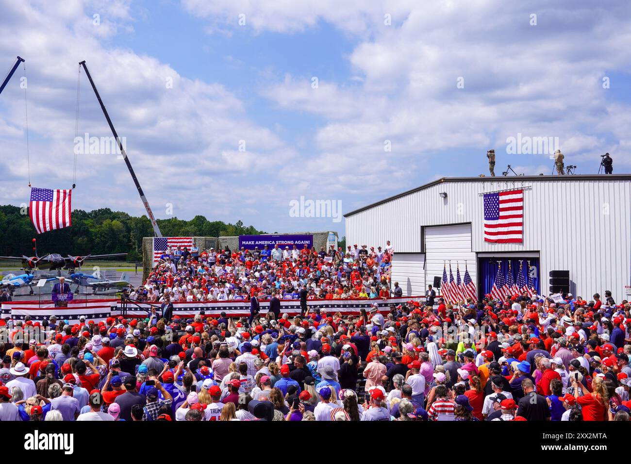 Asheboro, North Carolina, August 21, 2024  USA. Secret Service snipers are seen on a roof as U.S. Presidential candidate Donald Trump speaks during a campaign rally held at the North Carolina Aviation Museum on August 21, 2024 in Asheboro, North Carolina, USA. Stock Photo