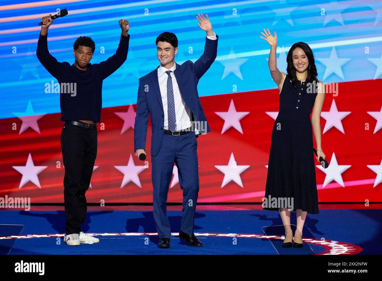 Alexander Hudlin, from left, Jasper Emhoff and Arden Emhoff wave after