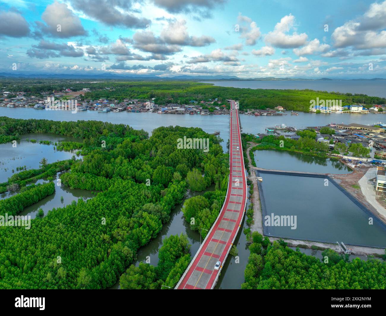 Aerial view landscape of fishing community along river, nestled within ...