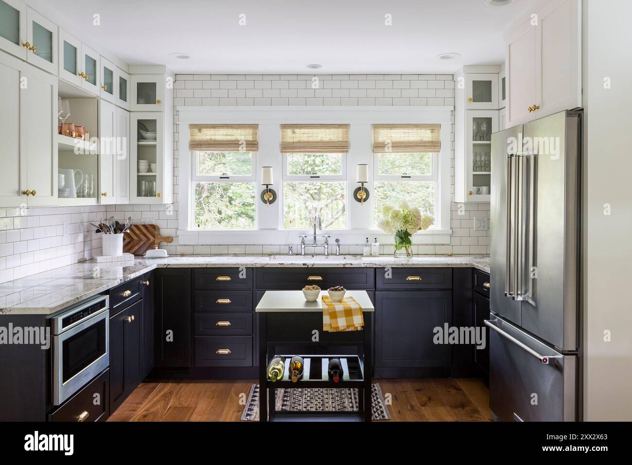 Stylish remodeled black and white kitchen in mid-century rambler Stock ...
