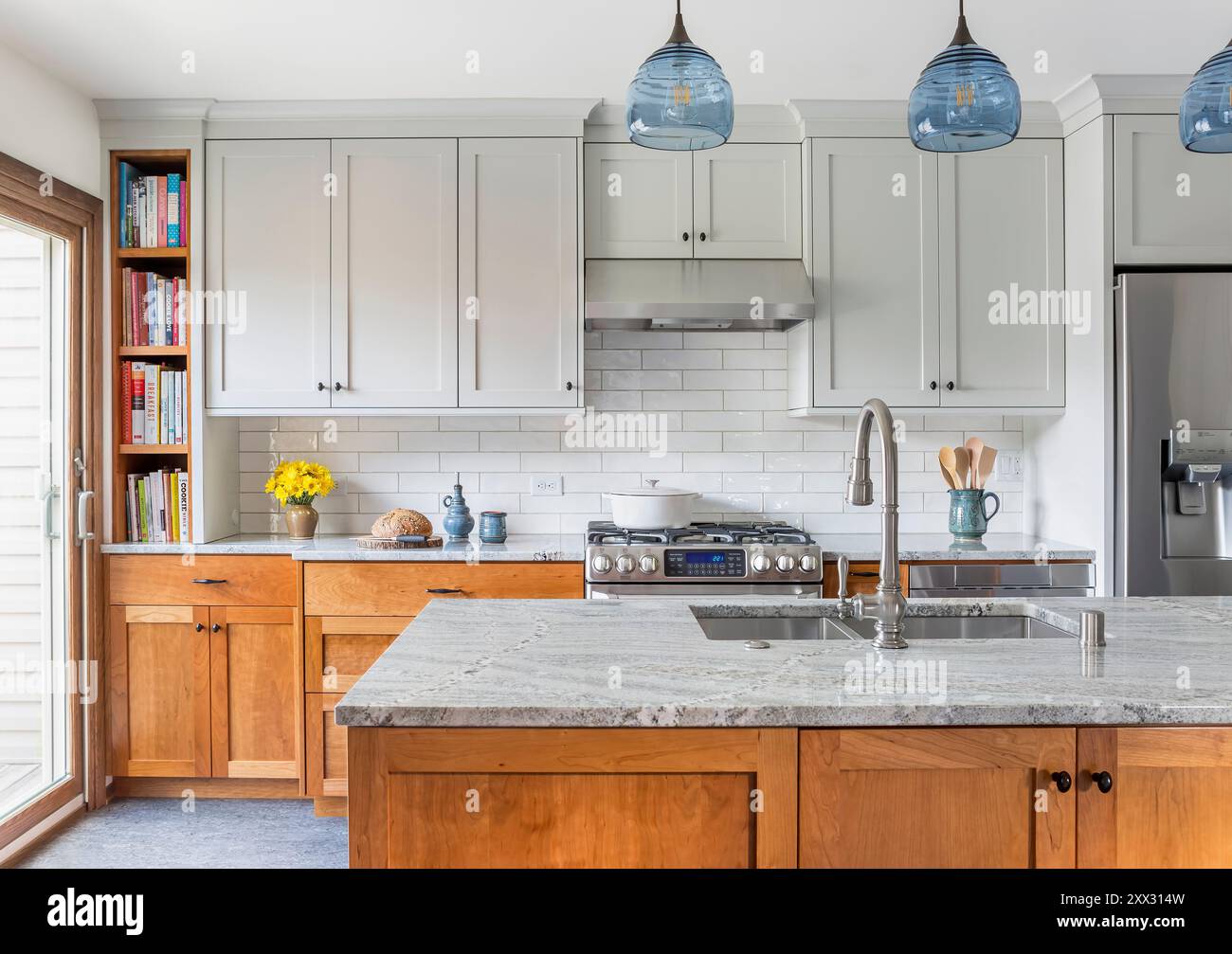 New kitchen with blue gray upper and red birch lower