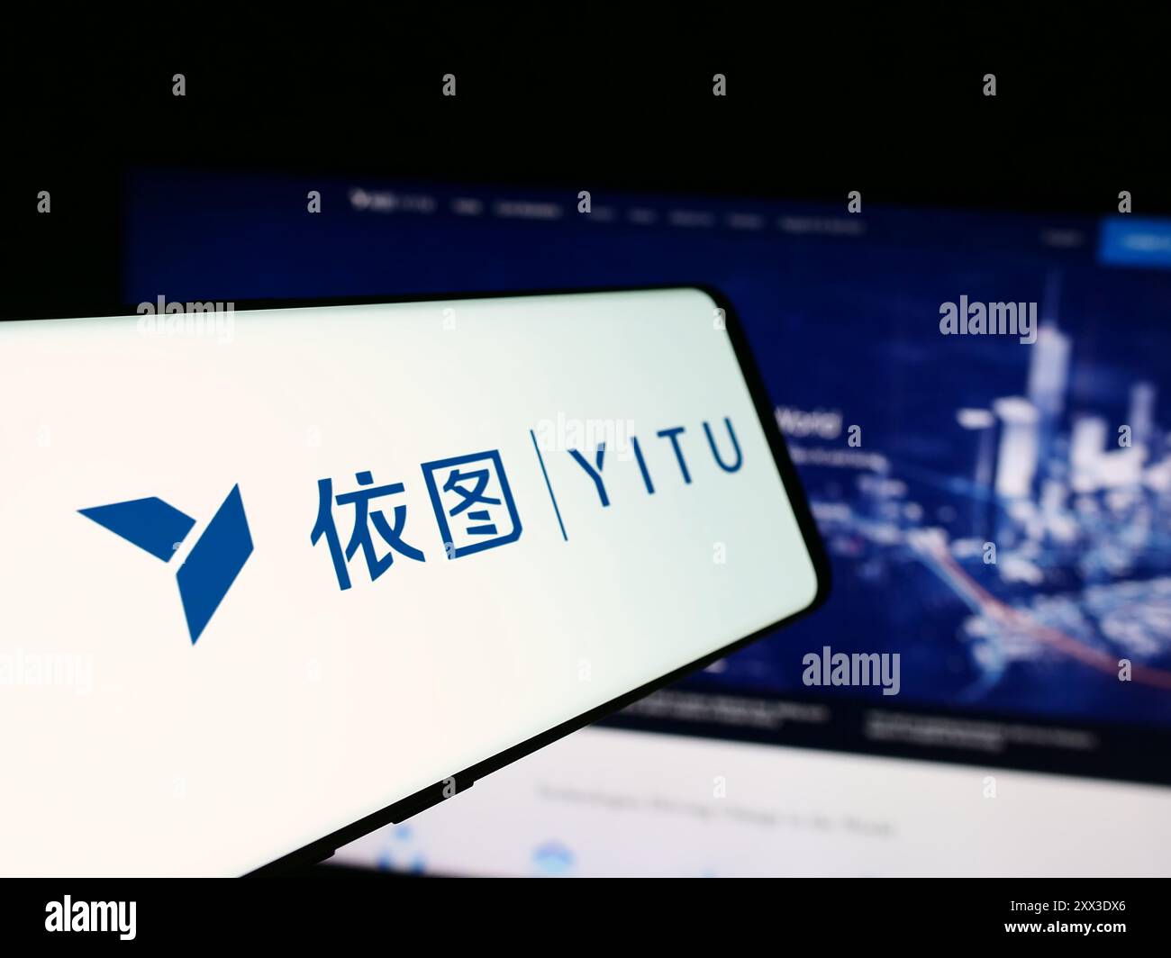 Cellphone with logo of Chinese AI company Shanghai YITU Technology Co. Ltd. in front of business website. Focus on center-left of phone display. Stock Photo