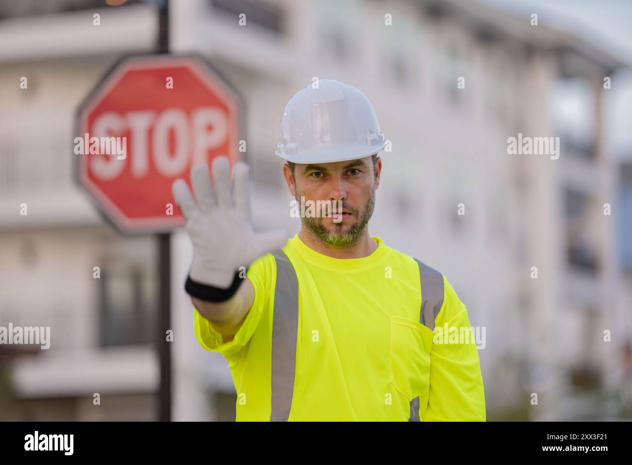 Stop Buildign Sign Builder with stop road sign. Builder with stop gesture, no hand ...