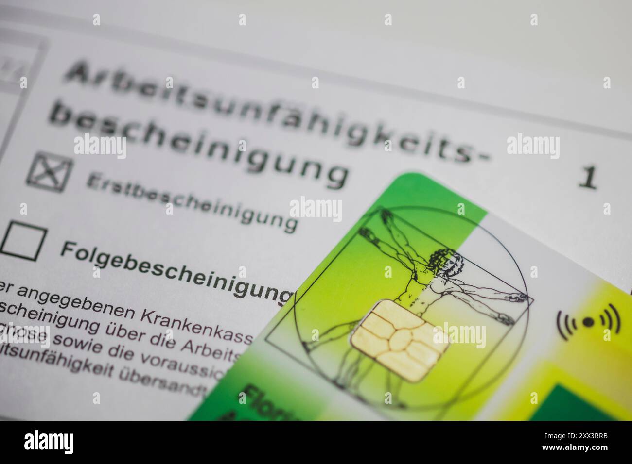 Berlin, Deutschland. 22nd Aug, 2024. An AOK health card is on a certificate of incapacity for work. Berlin, August 22, 2024. Credit: dpa/Alamy Live News Stock Photo