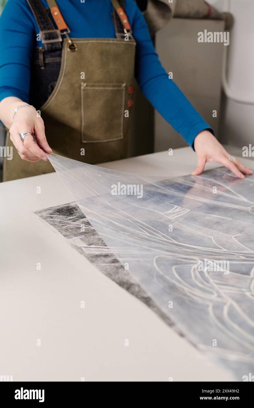 Woman artisan putting on apron hi-res stock photography and images - Alamy