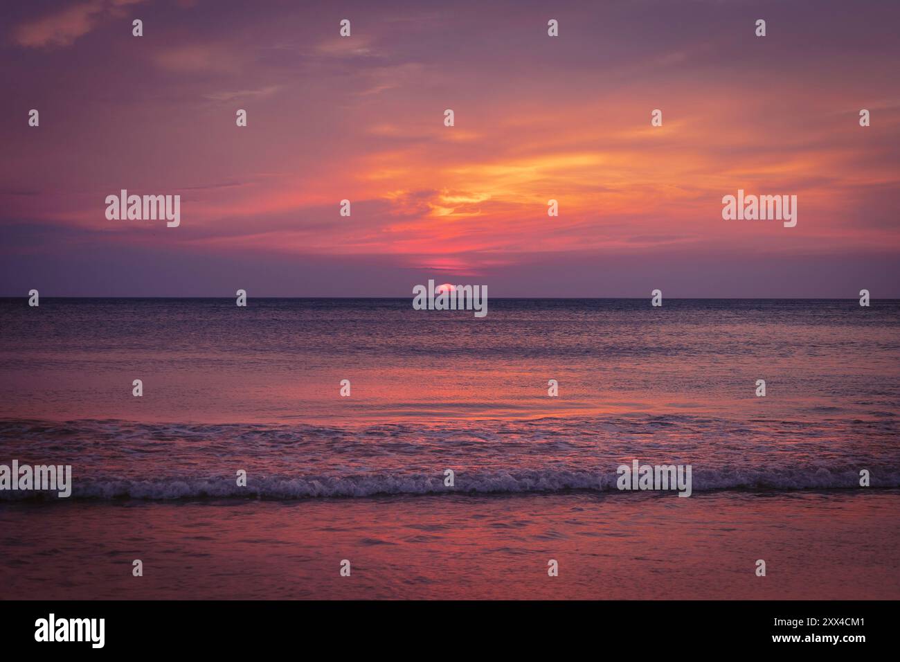 Beautiful pink sunset over ocean hi-res stock photography and images ...
