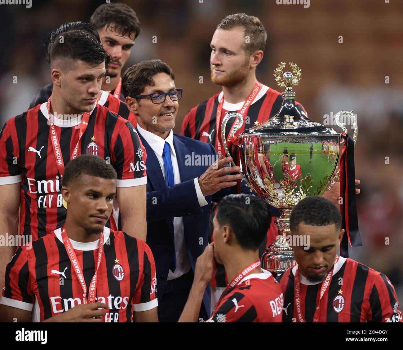 Milan, Italy. 13th Aug, 2024. Pier Silvio Berlusconi, prepares to present the trophy to Davide Calabria of AC Milan following the Trofeo Luigi Berlusconi match at Giuseppe Meazza, Milan. Picture credit should read: Jonathan Moscrop/Sportimage Credit: Sportimage Ltd/Alamy Live News Stock Photo