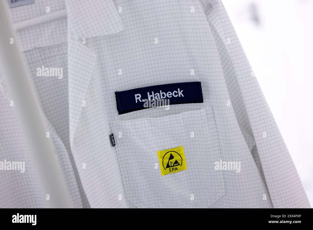 22 August 2024, North Rhine-Westphalia, Siegen: A lab coat with the ...