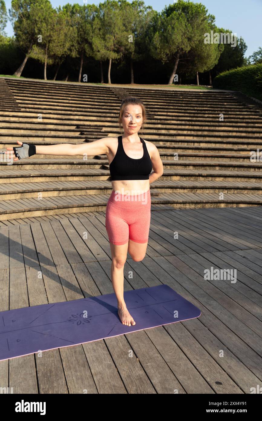 Woman stretches during yoga hi-res stock photography and images - Alamy