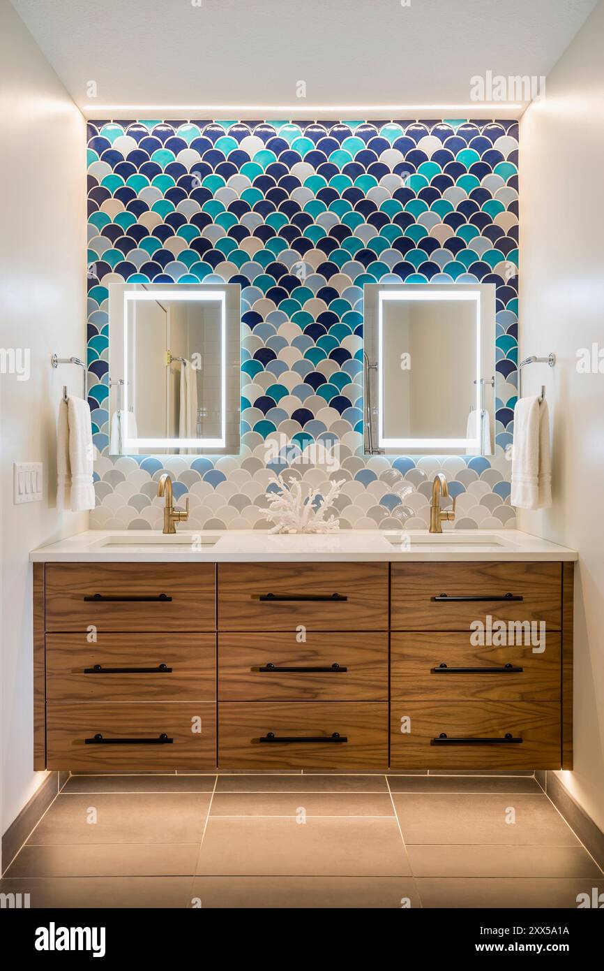 Modern bathroom renovation with wall mounted double vanity and colorful ...