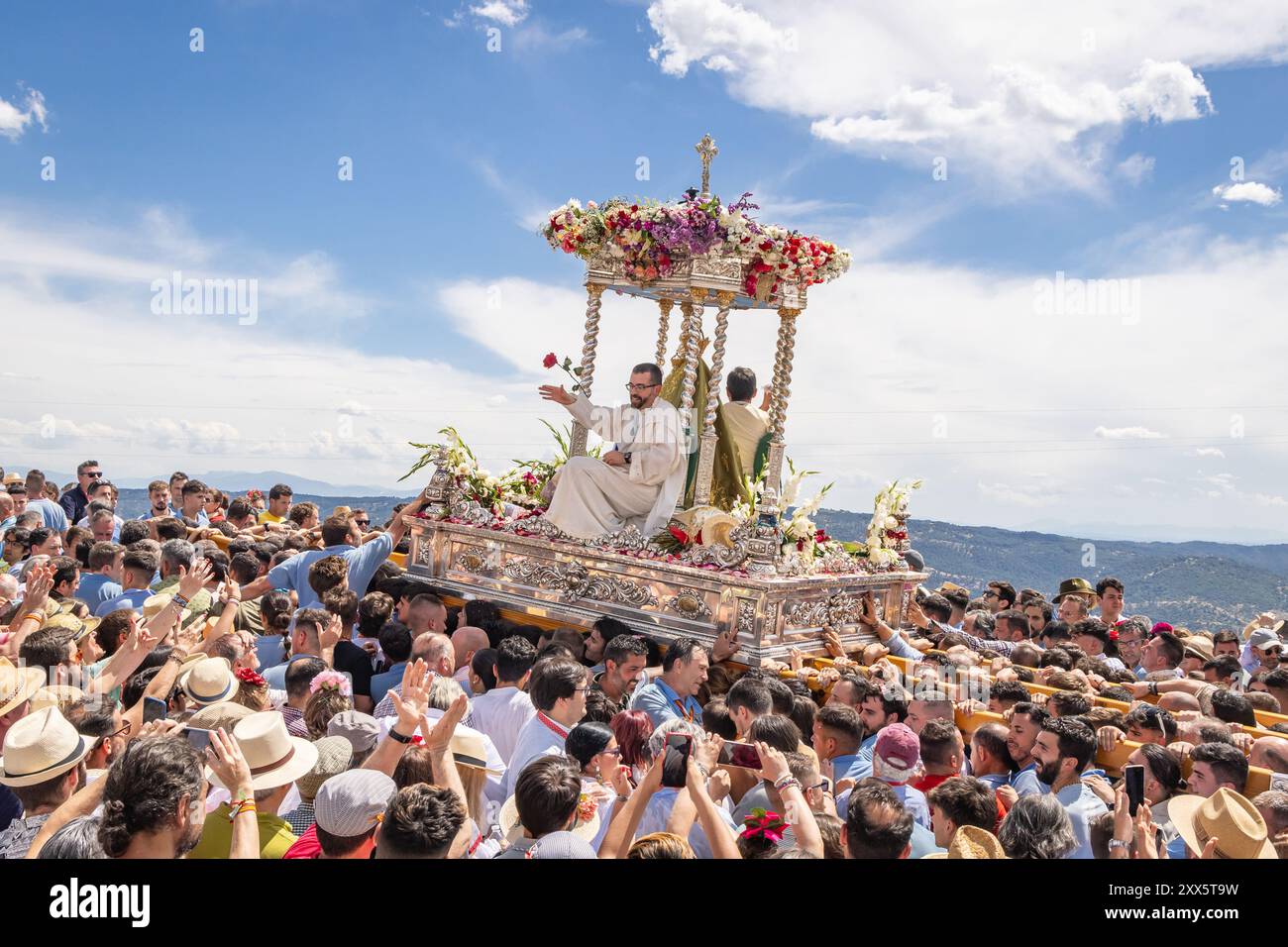 Virgen de la Cabeza, Andujar, Jaen Province, Andalusia, Spain. April 30, 2023. Priest being carried on a float at the annual pilgrimage for the Virgen Stock Photo