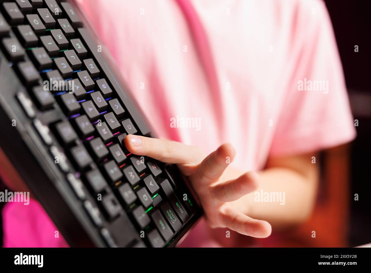 Close up on mechanical keyboard received by cute girl from sponsoring