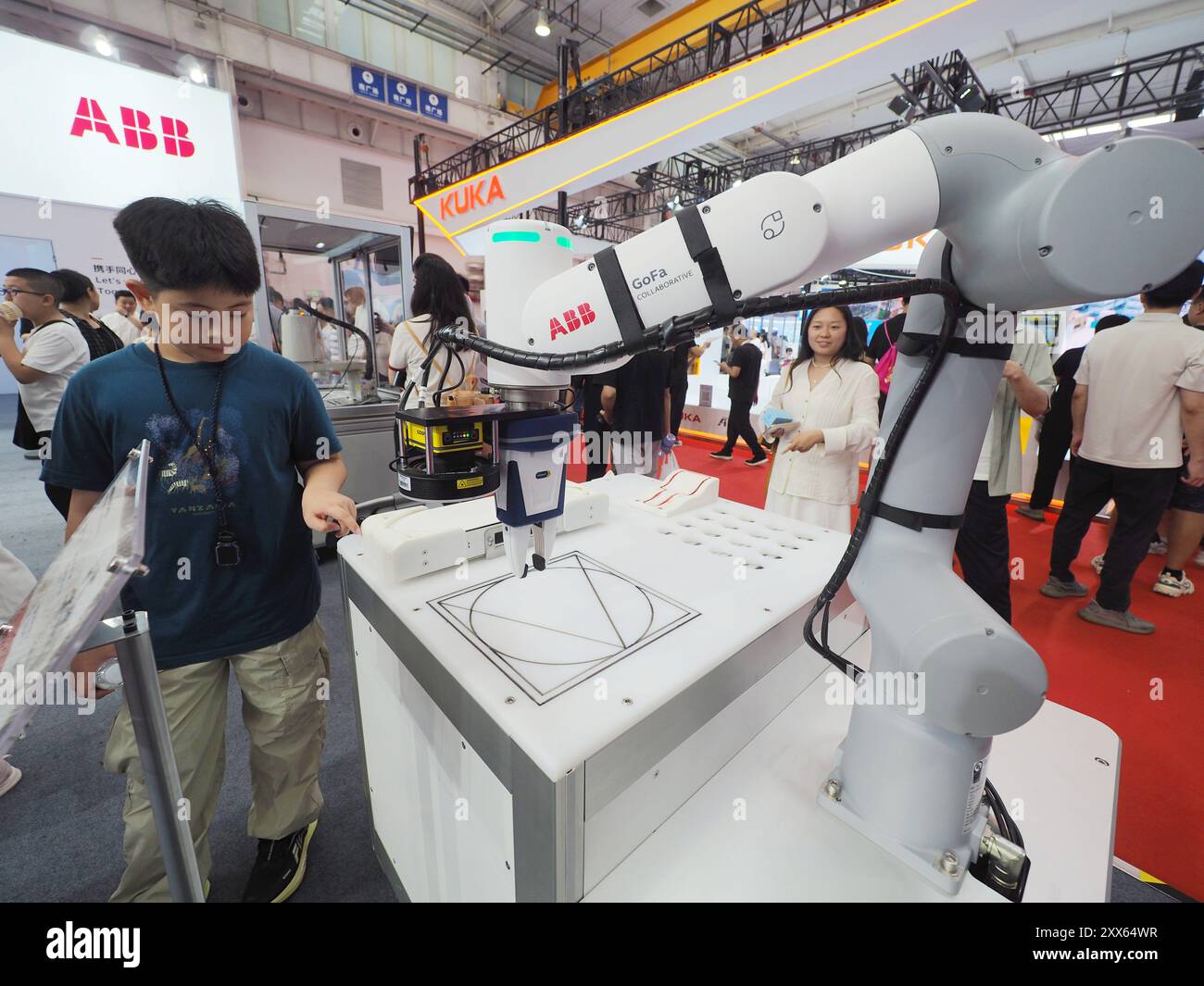 BEIJING, CHINA - AUGUST 22, 2024 - Visitors visit an 'educational robot' at the 2024 World Robot Conference in Beijing, China, August 22, 2024. Stock Photo