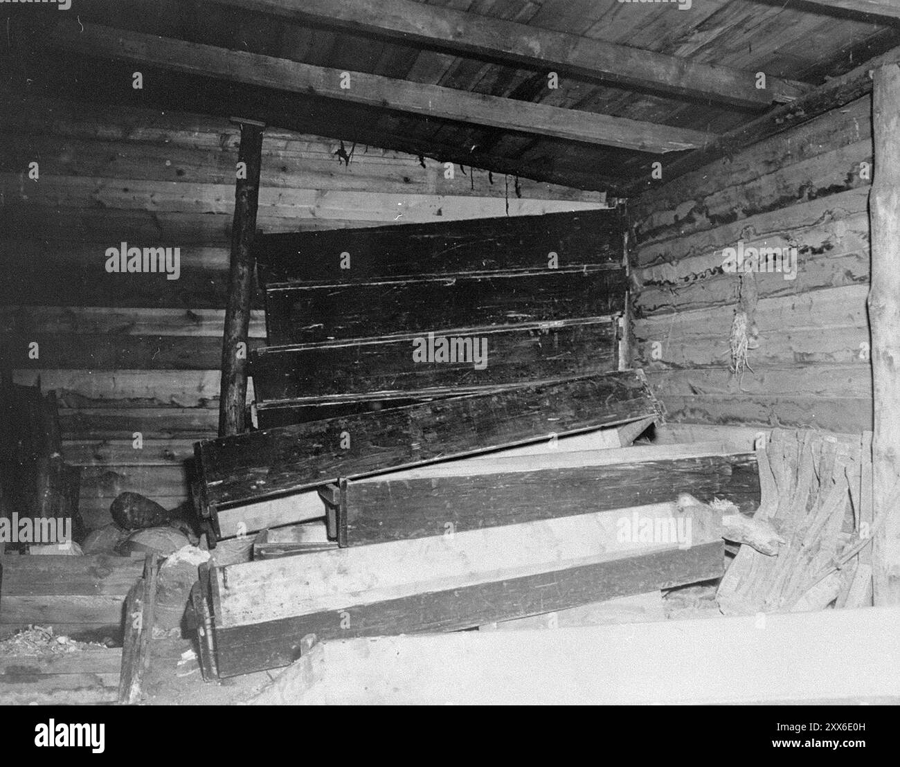 A room used for storing coffins in Bergen-Belsen concentration camp. The photo is dated 28th april 1945, two weeks after its liberation. The camp's position in the west of Germany meant that thousands of people were sent there as the east fell. 18000 people died in March 1945 alone, and 10000 died in the two weeks after liberation. They died of disease and neglect rather than the systematic abuse seen elsewhere. Stock Photo