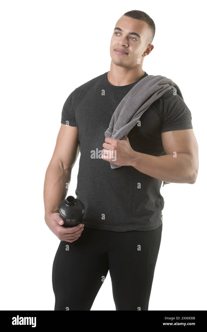 Man Holding A Protein Shake After A Workout In The Gym Isolated In man-holding-a-protein-shake-after-a-workout-in-the-gym-isolated-in