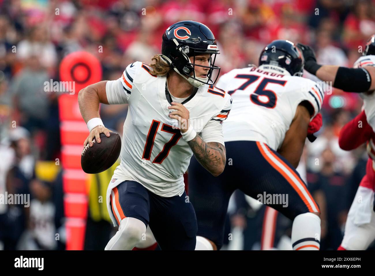 Chicago Bears quarterback Tyson Bagent rolls out during the first half