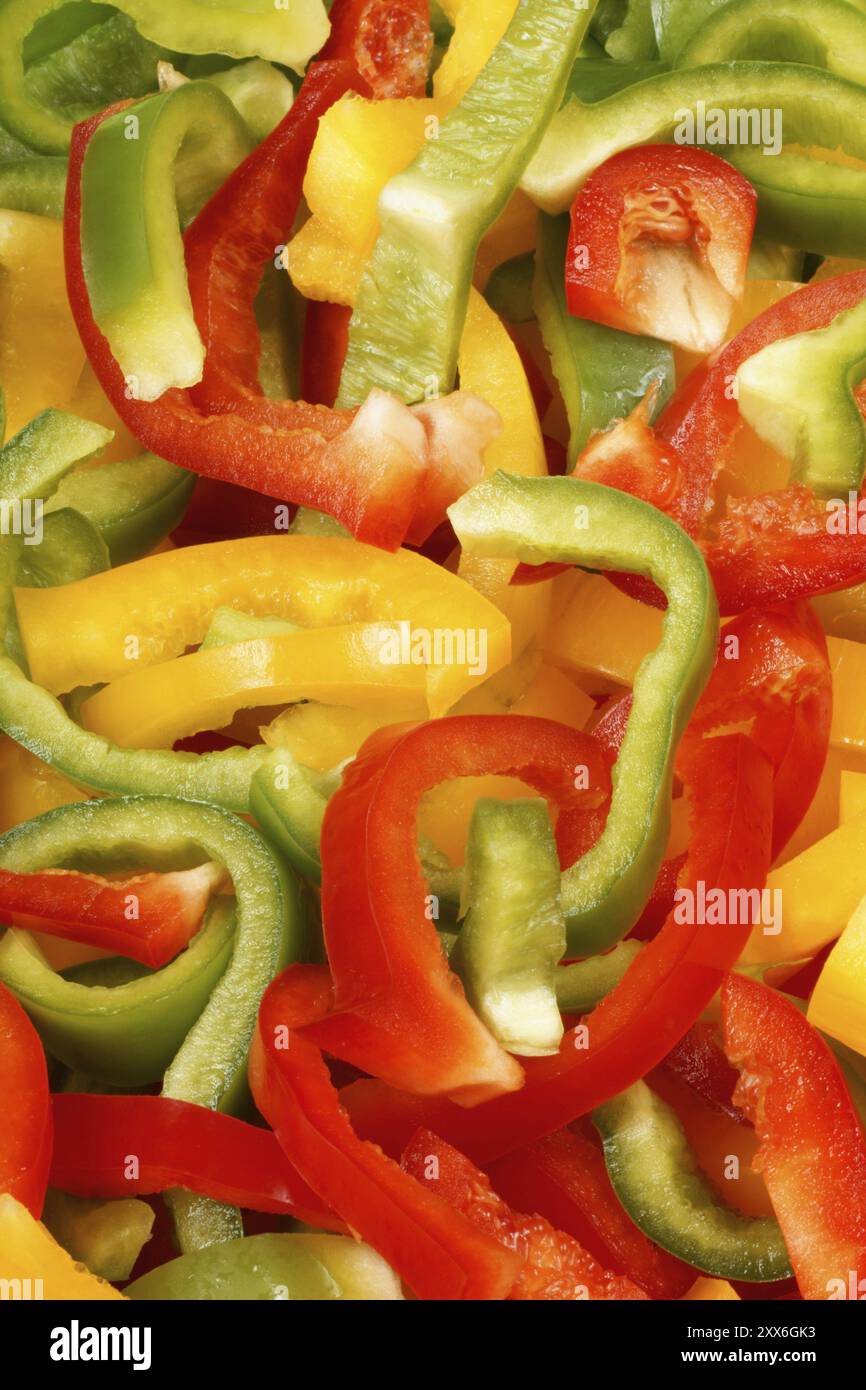 Organic background made of green, yellow and red bell peppers Stock ...