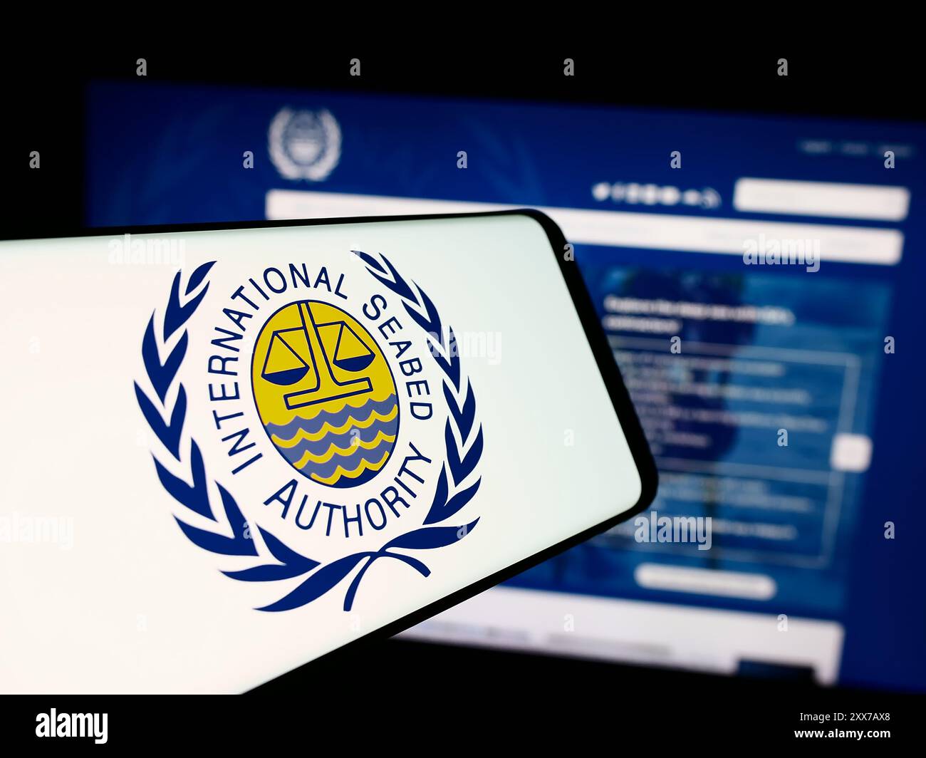 Smartphone with logo of organisation International Seabed Authority (ISA) in front of business website. Focus on center-right of phone display. Stock Photo