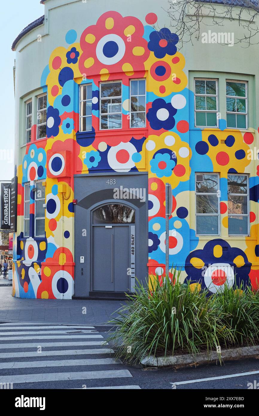 Surry Hills, Sydney a converted warehouse on the corner of Riley and Devonshire street painted with a bright colourful mural of flowers Stock Photo